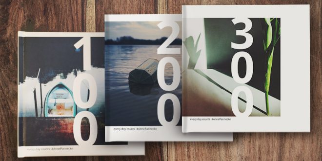 3 Instagram photo books on wood table